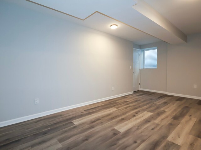 8220 Twana Dr, Urbandale, IA 50322 - spare room featuring baseboards and dark wood-style floors