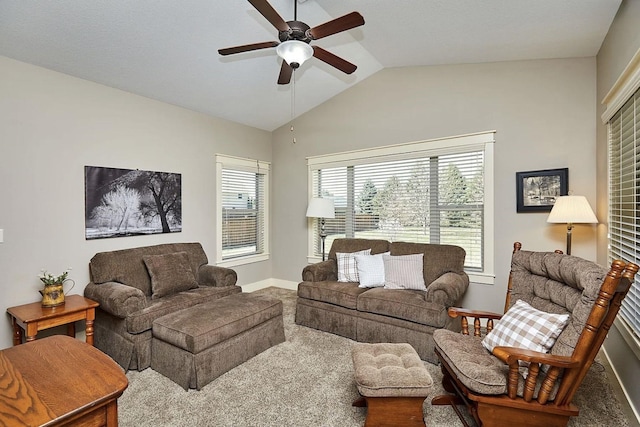 carpeted living area featuring vaulted ceiling, baseboards, ceiling fan, and plenty of natural light
