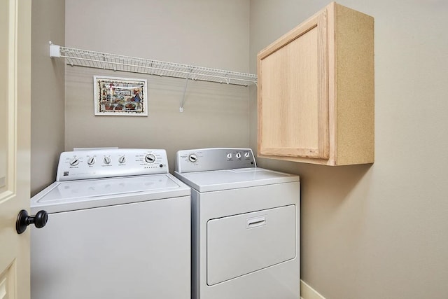washroom featuring washing machine and dryer