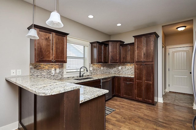kitchen with a peninsula, stainless steel dishwasher, a sink, tasteful backsplash, and dark brown cabinets