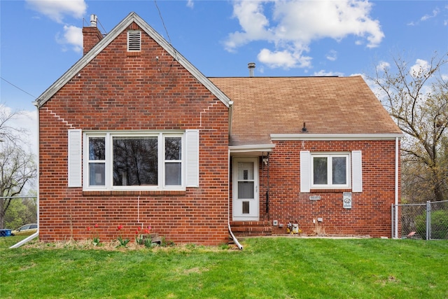 1804 E 33rd St, Des Moines, IA 50317 - view of front of house with a chimney, brick siding, and roof with shingles