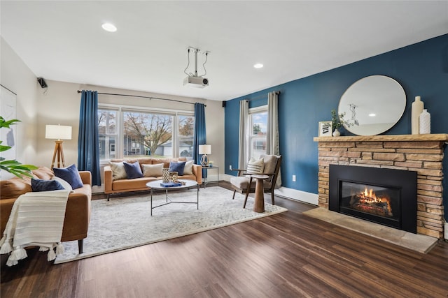 1804 E 33rd St, Des Moines, IA 50317 - living area with a stone fireplace, wood finished floors, and recessed lighting