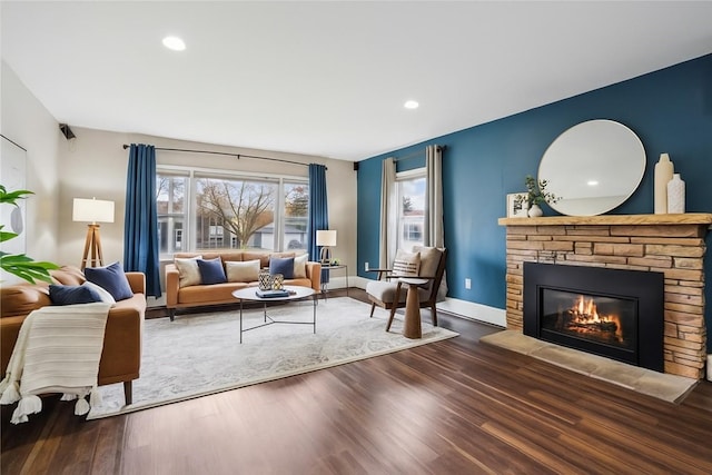 1804 E 33rd St, Des Moines, IA 50317 - living room with a fireplace, wood finished floors, recessed lighting, and baseboards