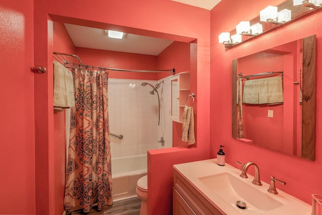 310 E Emma Ave, Des Moines, IA 50315 - full bath with vanity, shower / bathtub combination with curtain, toilet, and wood finished floors