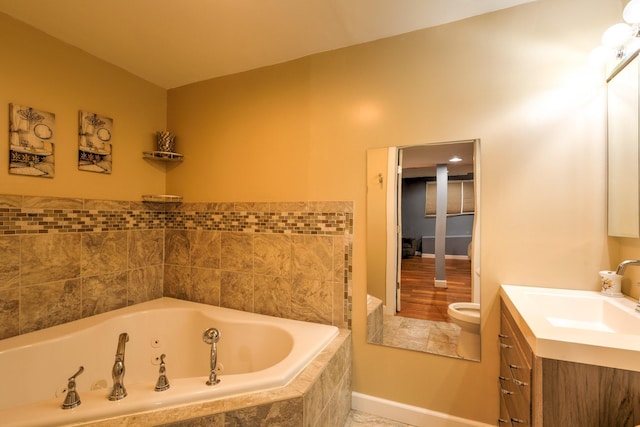 310 E Emma Ave, Des Moines, IA 50315 - full bath featuring a jetted tub, vanity, and toilet