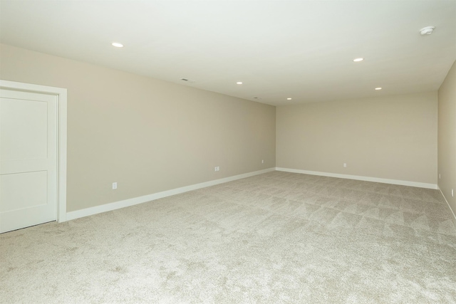 1202 Westview Dr, Huxley, IA 50124 - spare room featuring light carpet, recessed lighting, baseboards, and a smoke detector