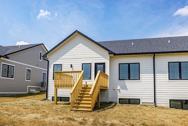 1204 Westview Dr, Huxley, IA 50124 - rear view of property featuring a wooden deck, stairs, a yard, and cooling unit