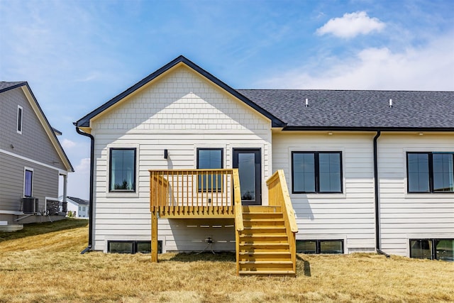 1204 Westview Dr, Huxley, IA 50124 - rear view of house featuring a deck, a yard, stairs, cooling unit, and roof with shingles