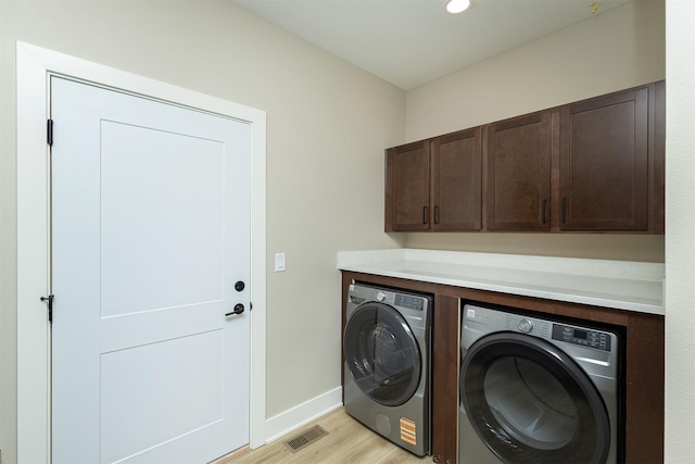 1204 Westview Dr, Huxley, IA 50124 - laundry area with washing machine and clothes dryer, cabinet space, light wood-style flooring, baseboards, and recessed lighting