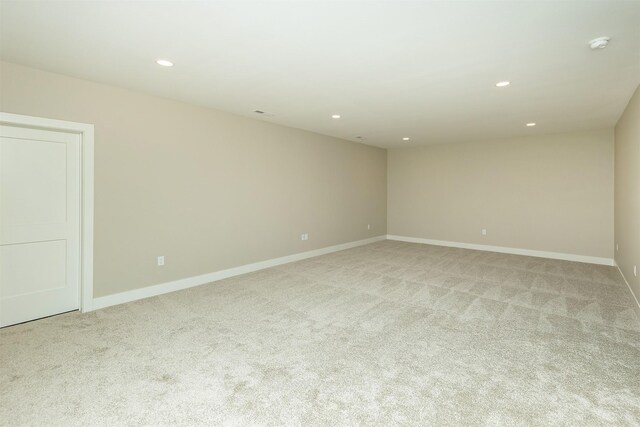 1204 Westview Dr, Huxley, IA 50124 - empty room featuring light carpet, recessed lighting, baseboards, and a smoke detector