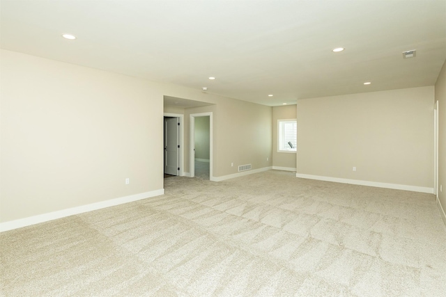 1206 Westview Dr, Huxley, IA 50124 - empty room featuring recessed lighting, light carpet, and baseboards
