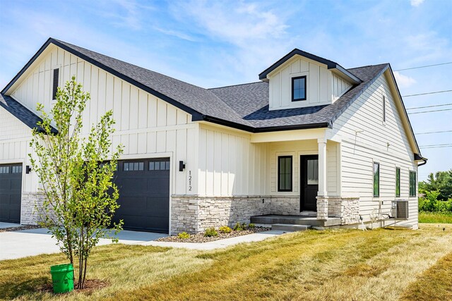 1206 Westview Dr, Huxley, IA 50124 - modern inspired farmhouse with stone siding, board and batten siding, and an attached garage