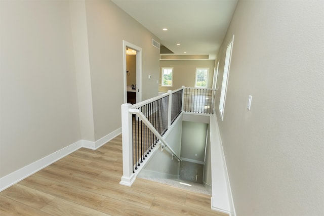 1206 Westview Dr, Huxley, IA 50124 - staircase with wood finished floors, baseboards, and recessed lighting
