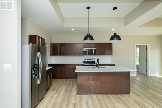 1206 Westview Dr, Huxley, IA 50124 - kitchen with appliances with stainless steel finishes, a sink, light wood-style floors, light countertops, and recessed lighting