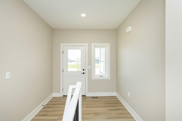 1208 Westview Dr, Huxley, IA 50124 - entryway with light wood-type flooring, baseboards, and recessed lighting