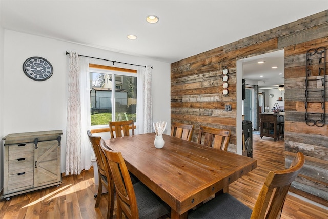 4830 70th Pl, Urbandale, IA 50322 - dining area featuring wood finished floors, wood walls, and recessed lighting