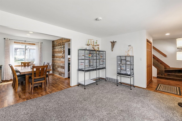 4830 70th Pl, Urbandale, IA 50322 - carpeted dining area with baseboards, stairway, wood finished floors, and recessed lighting