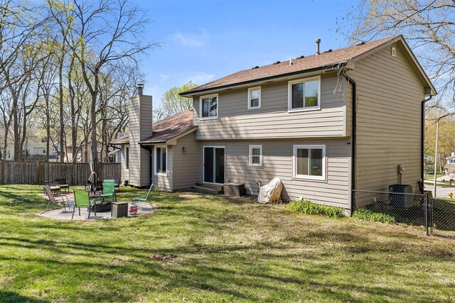 4830 70th Pl, Urbandale, IA 50322 - back of property featuring a chimney, a patio, entry steps, and cooling unit