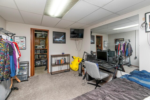 4830 70th Pl, Urbandale, IA 50322 - bedroom featuring a paneled ceiling, carpet flooring, and an office area