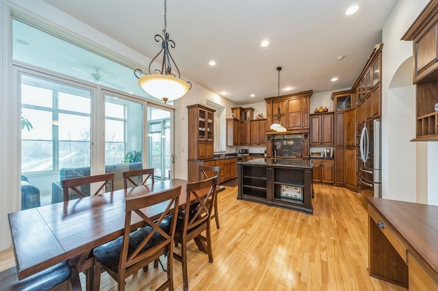 9289 Winterberry Ct, West Des Moines, IA 50266 - dining room with ceiling fan, recessed lighting, and light wood-style flooring
