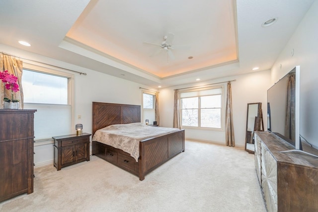 9289 Winterberry Ct, West Des Moines, IA 50266 - bedroom with a tray ceiling, light colored carpet, and multiple windows