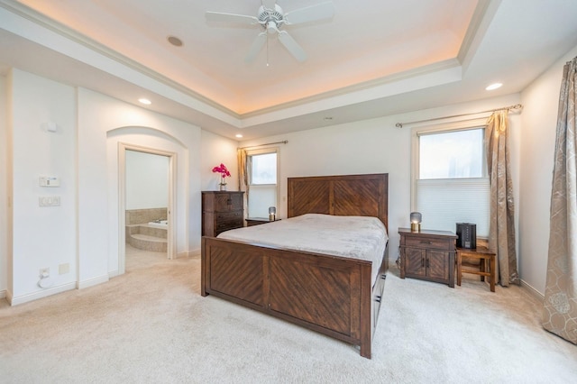 9289 Winterberry Ct, West Des Moines, IA 50266 - bedroom featuring baseboards, a tray ceiling, recessed lighting, and light colored carpet