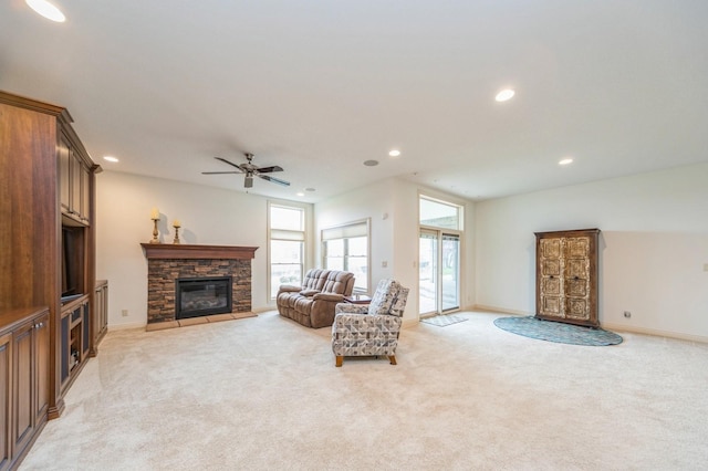 9289 Winterberry Ct, West Des Moines, IA 50266 - living area with light colored carpet, ceiling fan, recessed lighting, and a fireplace