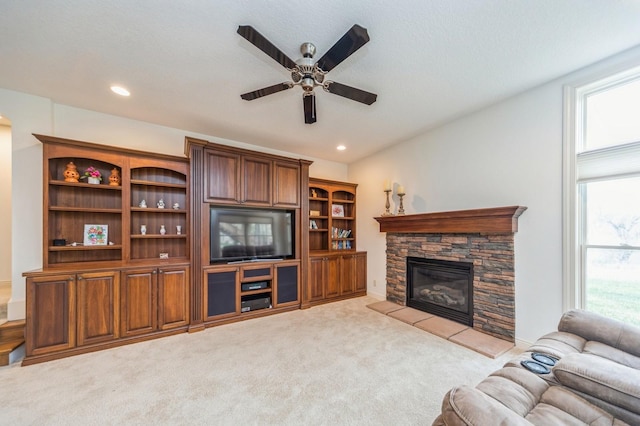 9289 Winterberry Ct, West Des Moines, IA 50266 - living area featuring recessed lighting, a stone fireplace, carpet floors, and a ceiling fan