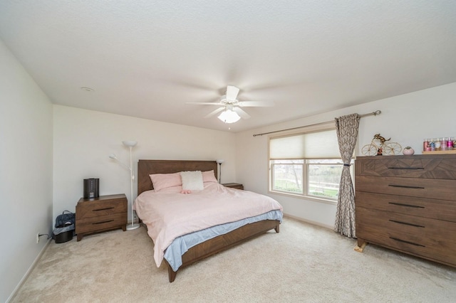 9289 Winterberry Ct, West Des Moines, IA 50266 - bedroom with a ceiling fan, baseboards, and light carpet