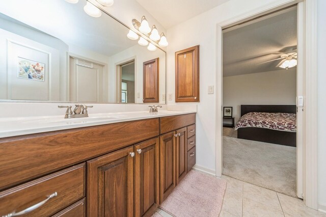 9289 Winterberry Ct, West Des Moines, IA 50266 - ensuite bathroom featuring double vanity, ensuite bath, tile patterned flooring, and a sink