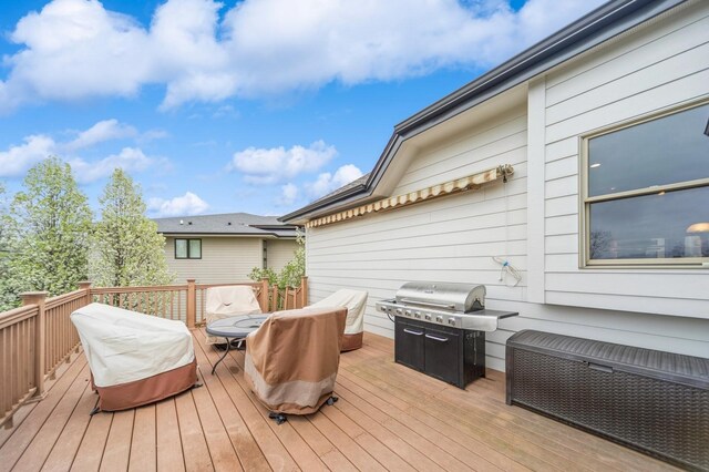 9289 Winterberry Ct, West Des Moines, IA 50266 - wooden deck featuring grilling area and outdoor dining space