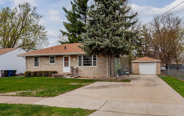 view of front facade with a front lawn, a detached garage, stone siding, fence, and an outdoor structure