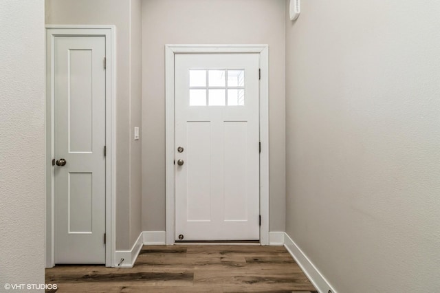 4901 NW 15th St, Ankeny, IA 50023 - doorway featuring baseboards and wood finished floors