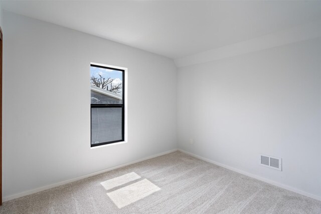312 N 3rd Ave, Marshalltown, IA 50158 - carpeted empty room with baseboards and visible vents