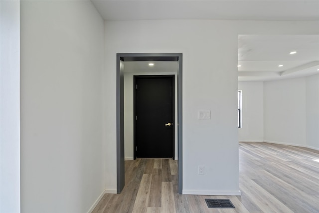312 N 3rd Ave, Marshalltown, IA 50158 - hallway featuring baseboards, light wood-style floors, and visible vents