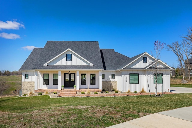 5094 Grand Ridge Dr, West Des Moines, IA 50265 - modern inspired farmhouse with board and batten siding, stone siding, and a front lawn