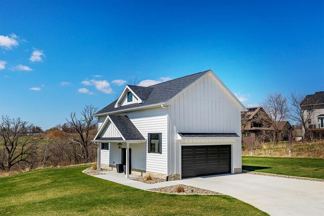 5094 Grand Ridge Dr, West Des Moines, IA 50265 - modern farmhouse style home featuring board and batten siding, a front lawn, concrete driveway, and a shingled roof