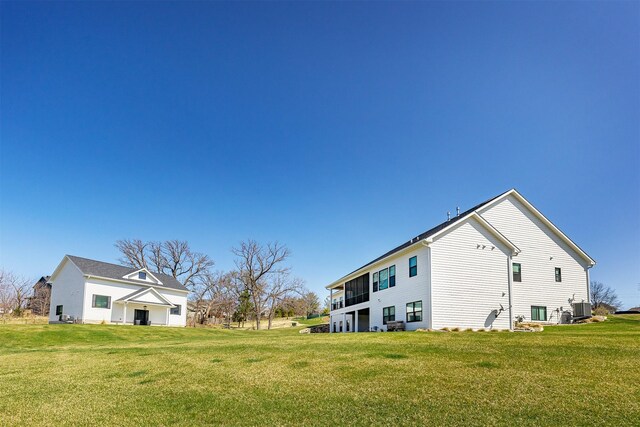 5094 Grand Ridge Dr, West Des Moines, IA 50265 - view of side of property featuring a yard and a central AC unit