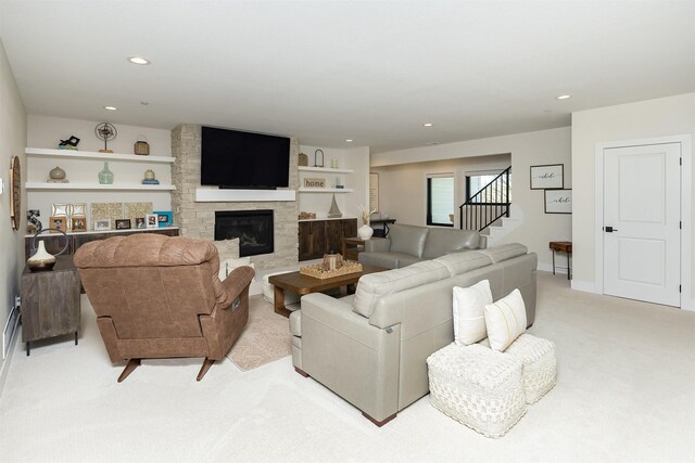 5094 Grand Ridge Dr, West Des Moines, IA 50265 - living area featuring light colored carpet, stairway, recessed lighting, and a fireplace