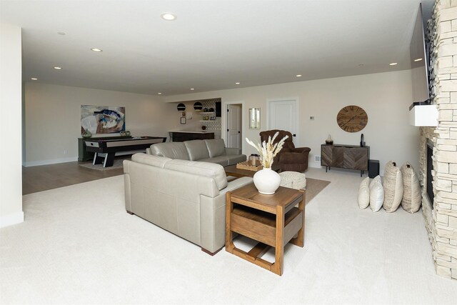 5094 Grand Ridge Dr, West Des Moines, IA 50265 - living room with a fireplace, recessed lighting, and carpet