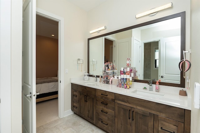 5094 Grand Ridge Dr, West Des Moines, IA 50265 - bathroom with double vanity, connected bathroom, and tile patterned floors
