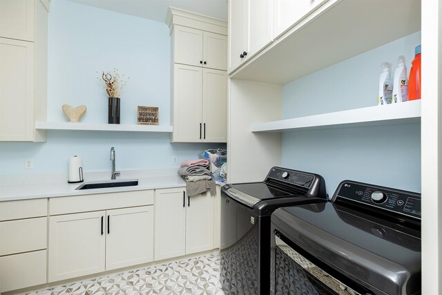 5094 Grand Ridge Dr, West Des Moines, IA 50265 - laundry area featuring washing machine and clothes dryer and cabinet space