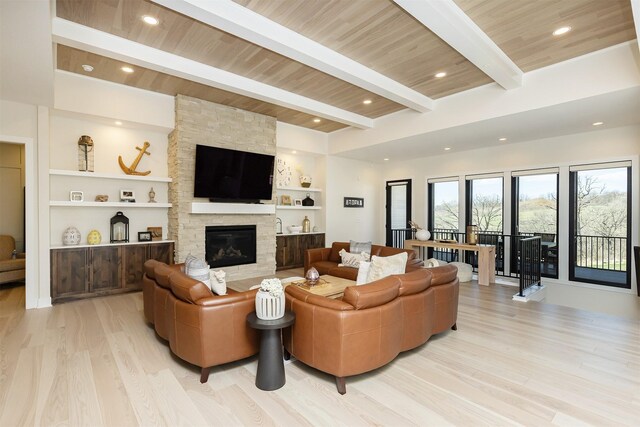5094 Grand Ridge Dr, West Des Moines, IA 50265 - living room featuring light wood finished floors, a fireplace, a wood ceiling with exposed beams, and built in features