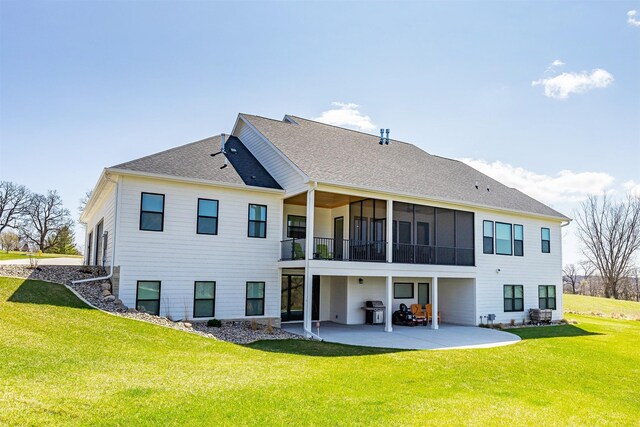 5094 Grand Ridge Dr, West Des Moines, IA 50265 - back of house featuring a patio, a yard, and roof with shingles
