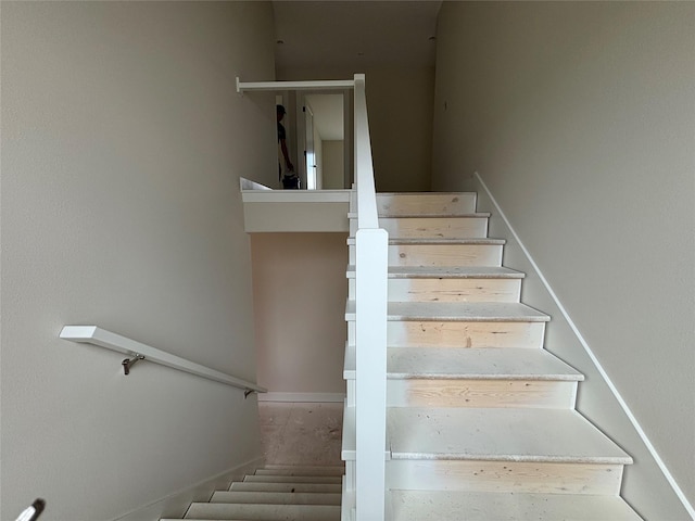 1258 S 92nd St, West Des Moines, IA 50266 - staircase featuring baseboards