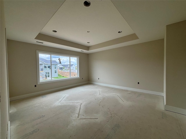 1258 S 92nd St, West Des Moines, IA 50266 - unfurnished room with a tray ceiling and baseboards