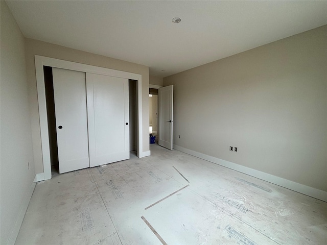 1258 S 92nd St, West Des Moines, IA 50266 - unfurnished bedroom featuring baseboards and a closet