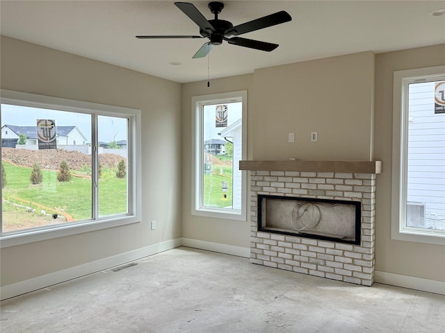 1258 S 92nd St, West Des Moines, IA 50266 - unfurnished living room featuring baseboards, a brick fireplace, and a ceiling fan