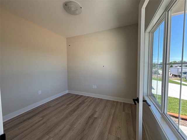 1258 S 92nd St, West Des Moines, IA 50266 - spare room with wood finished floors and baseboards