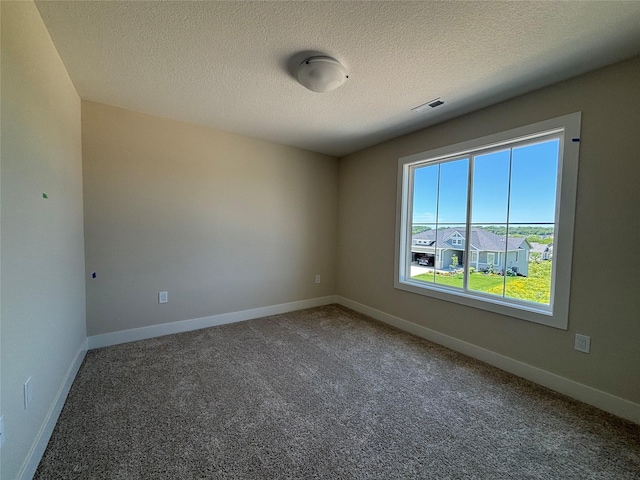 1258 S 92nd St, West Des Moines, IA 50266 - carpeted spare room featuring a textured ceiling